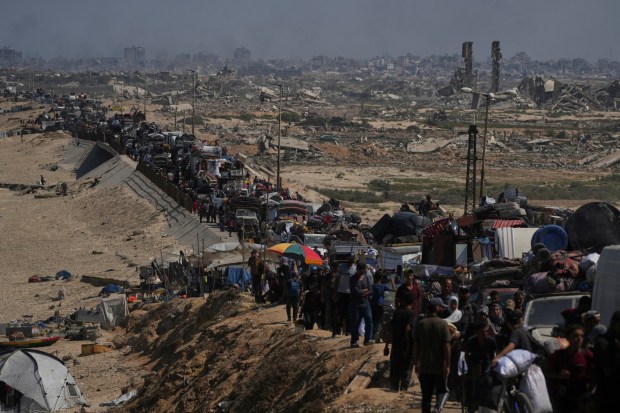 Displaced Palestinians flee northern Gaza along the coastal road toward the south, after Israel's military says its expanded operation in Gaza City has begun and warns residents to leave, Tuesday, Sept. 16, 2025. (AP Photo/Abdel Kareem Hana)